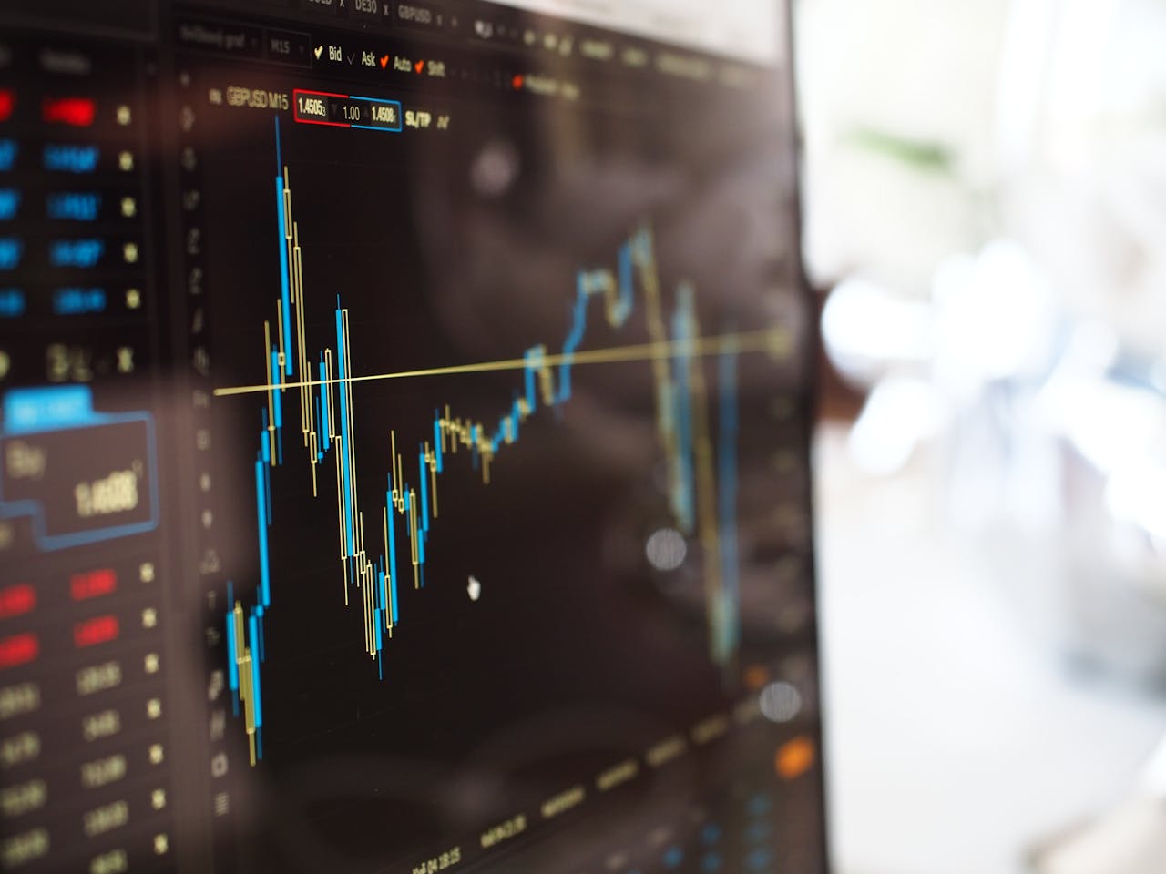gallery-03 Detailed view of financial trading graphs on a monitor, illustrating stock market trends.